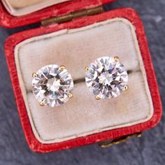 These dazzling stud style pierced earrings are each accented with one (1) round brilliant cut diamond set into a four-prong head. The earrings are finished with friction style backs. Yellow Diamond Earring, Fancy Yellow Diamond, Stud Style, Spiral Earrings, Diamond Stud Earrings, Enamel Earrings, Diamond Drops, Diamond Drop Earrings, Diamond Stud