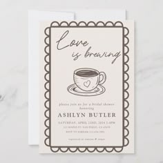 a card with a coffee cup on it and the words love is brewing written in brown