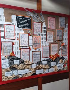 a bulletin board with many pieces of paper and some writing on the wall above it