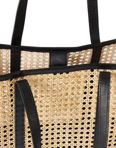 A rattan and leather tote in cool, neutral tones, Bembien's Margot bag is the go-anywhere, carry-everything bag for summer and beyond. Handwoven in Bali, it features a leather base that can handle the weight of all of your essentials and leather shoulder straps that feel soft as butter on sun-kissed shoulders. Its stylish, oversized shape is perfect for day trips, lazy beach days, and summer road trips. Summer Road Trips, Essential Accessories, Summer Road Trip, Black Leather Tote, Beach Vibes, Woven Bag, Beach Vibe, Sun Kissed, Neutral Tones