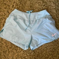 Never Worn Small Nike Workout Shorts Light Blue Casual Workout Bottoms, Nike Summer Beach Bottoms, Light Blue Sporty Bottoms For Spring, Sporty Light Blue Bottoms For Spring, Nike Blue Bottoms For Summer, Nike Bottoms For Beach And Spring Season, Light Blue Athleisure Bottoms For Spring, Nike Light Blue Short Bottoms, Nike Light Blue Shorts