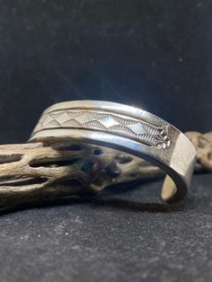 Spectacular Handmade Native American Navajo plain sterling silver cuff Bracelet by artist Bruce Morgan. Stamped sterling & by artist Bruce Morgan. Conditions are new with tags. This gorgeous bracelet is made with the famous Navajo style. The bracelet is extremely detailed. Inside of bracelet also has gorgeous stamping. Very Heavy. Stamped inside From one end to the other the bracelet is approximately 6 inch's The opening of the bracelet is approximately 1 1/2 inch's. The width of the bracket is Bohemian Silver Hand Stamped Jewelry, Silver Bohemian Hand Stamped Jewelry, Silver Hand-stamped Bohemian Jewelry, Artisan Sterling Silver Bracelet With Polished Finish, Engraved Sterling Silver Bracelet Gift, Hand Stamped Silver Bohemian Jewelry, Vintage Silver Bracelets Hand Stamped, Southwestern Engraved Sterling Silver Bracelet Gift, Bohemian Silver Hand Stamped Bracelets