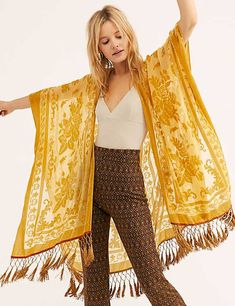 Get ready to boogie with the Kindle Shawl! This floral burnout velvet cover up is perfect for those elegant days, but also adds some flair to your casual outfits. Inspired by vintage designs, the tassel hemline and sheer, lightweight fabric will have you dancing into the day in style. Details: Vintage style Kindle Shawl Floral Pattern Type Sheer lightweight Burnout Velvet Tassel hemline Fits large. Please check this store's sizing info Fabric + Care: Polyester Burnout Velvet. Hand wash or machin Free People Kimono, Festival Mode, Look Boho Chic, Sheer Kimono, Boho Festival Fashion, Estilo Hippie, Mode Boho, Mode Inspo, Mode Inspiration