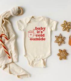 Baby it's cold outside onesie®. Super cute and trendy Christmas outfit for newborns, infants, and toddlers. Buttery-soft cotton. Unisex design can be dressed up or down. Perfect for the winter, holidays, and Christmas pictures. Baby it's cold outside onesie® sizes are available in: 3-6m, 6-9m, 12m, 18m, 24m Baby it's cold outside T-shirt sizes are available in: 12m, 18m, 2T, 3T, 4T Larger sizes may be available upon request Colors available: Natural onesie/bodysuit or shirt with red text Natural Thanksgiving Baby Shirt, Christmas Onesie Cricut, 1st Christmas Shirt, Infant Christmas Shirts, Diy Christmas Onesie, Funny Christmas Onesies, Cricut Kids Christmas Shirts, Christmas Toddler Shirt, Baby Vinyl Projects