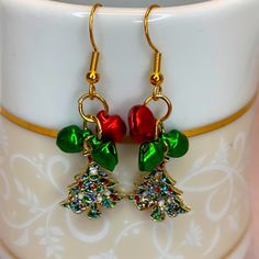 Holiday Christmas Tree Bells Dangling Earrings Colors Might Look Slightly Different On Screen Listing Is For: 1 Earring Set Handmade Earring Set Fashion Jewelry: Hooks Plated One Size: Approximately 1” Green Holiday Earrings For Festive Occasions, Green Earrings For Festive Holiday Occasions, Festive Dangle Earrings For Christmas, Green Statement Earrings, Thick Gold Hoop Earrings, Pumpkin Earrings, Holiday Christmas Tree, Sparkle Earrings, Crystal Stud Earrings