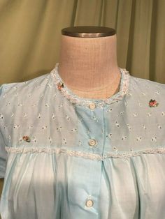 "This is a pretty pajama set from the 60s. Labeled, \"Katz\". Tagged a size 36, bust measures 42\", see measurements below. The set is made of light blue cotton blend. The long pants have elastic waist. The top has lace trim & appliqued flowers on the eyelet bodice with 5 buttons down the front. It has short sleeves & a smock shape. Condition is very good. I believe this is new, old stock, as the labels look like they were never laundered, still crisp! No wear, soil, or stains. Lovely! M Light Blue Cotton Sleepwear, Light Blue Cotton Sleepwear For Home, Vintage Cotton Sets For Daywear, Vintage Blue Sleepwear, Retro Fitted Sleepwear For Loungewear, Fitted Retro Sleepwear For Loungewear, Retro Spring Daywear Sets, Vintage Short Sleeve Sleepwear With Lace Trim, Vintage Long Sleeve Loungewear Set