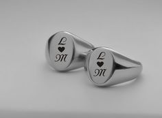 Our personalized silver signet ring set can be custom engraved for your engagement, promise rings or wedding bands. A personalized ring is a sentiment of love that can be inscribed with names, dates or a custom message. Personalized Signet Ring Set Finish: High Polish Stainless Steel Sizes available: 5-6-7-8-9-10-11-12-13-14-15 IMPORTANT: Don't guess - find out how to accurately measure your ring size The most accurate way to determine your ring size is to visit a local jewelry store where they Silver Rings With Name Engraving For Valentine's Day, Personalized Silver Rings For Valentine's Day, Formal Customizable Oval Signet Ring, Customizable Couples Jewelry For Anniversary, Stainless Steel Engraved Ring With Polished Finish For Promise, Stainless Steel Polished Engraved Promise Ring, Silver Engraved Ring With Initials For Wedding, Silver Engraved Wedding Ring With Initials, Silver Rings With Initials For Valentine's Day