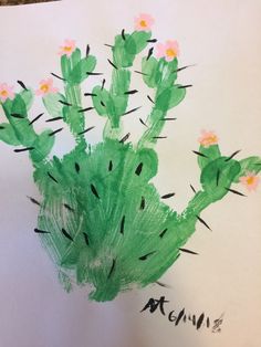 a child's drawing of a green cactus