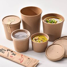 there are many cups and containers with food in them on the table next to each other