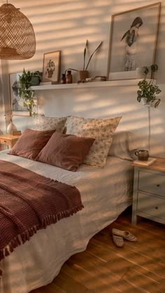 a bed sitting in a bedroom next to a window with blinds on the windowsill