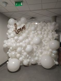 an office decorated with balloons and the word love