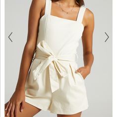 Beige Romper Shaped With Slender Shoulder Straps And A Square Neckline With A Fixed Wrap Tie At The Waist. Zipper Back With Side Pockets. Tie Belt Is Removable. 65% Cotton 30% Polyester. Brand New, Tags Are No Longer Attached But Item Was Never Worn! Chic Cotton Jumpsuits And Rompers With Tie Straps, Chic Cotton Jumpsuits And Rompers For Summer, Chic Cotton Summer Jumpsuits And Rompers, Beige Cotton Jumpsuits And Rompers For Summer, Summer Cream Overall Jumpsuits And Rompers, Chic Beige Cotton Jumpsuits And Rompers, Chic Beige Cotton Jumpsuit, Chic Cream Jumpsuits And Rompers For Vacation, Cream Sleeveless Jumpsuit For Day Out