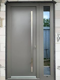 a modern steel door with glass and side panels