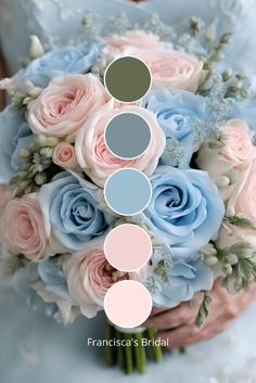 a bridal bouquet with blue and pink roses