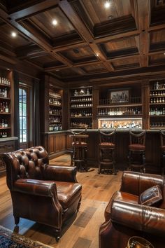 a room filled with leather furniture and lots of shelves full of bottles on the wall