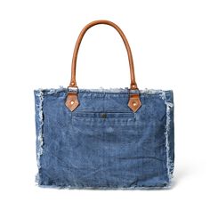 Turn heads with this denim and leather bag- where distressed jeans meet contemporary style. The fringes on the edges add a playful boho touch, giving it a casually chic vibe. The patchwork on the front gives it a stylish finish. Its spacious central compartment effortlessly accommodates books, diaries, files, or documents, making it a versatile choice for office, college, or even weekend getaways. Embrace casual elegance with this distinctive shopper's bag that seamlessly blends fashion with fun Casual Fringe Bags For Everyday Use, Casual Everyday Fringe Bags, Denim Hobo Tote Bag For Travel, Denim Hobo Bag For Travel In Tote Shape, Travel Denim Hobo Bag In Tote Shape, Denim Blue Hobo Bag For Travel, Travel Denim Hobo Tote Bag, Rectangular Medium Wash Shoulder Bag For Travel, Travel Shoulder Bag In Medium Wash Rectangular Shape