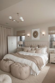 a large bed sitting in the middle of a bedroom next to two lamps on either side of it