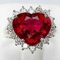 METAL SPECIFICATIONS White Gold 14K STONE SPECIFICATIONS Stone Name: Ruby & Diamond Stone Cut : Heart and Round Stone Specifications: There is one red ruby in the center of approx. 10.00 carats and approx. 0.75 carats smaller diamonds on the side. Natural earth mined stones. Color : Red/F Clarity : AAA/VS1 Total : Approx. 10.75 carats RING SPECIFICATIONS Appraised Value : $2500 0.00 Ring Size : 6.5 (Can ship in any size you want) Comes with Certificate White Gold Ruby Ring, Heart Shaped Engagement Rings, Brian Froud, Silver Jewelry Accessories, Ruby Ring Gold, Ruby Diamond Rings, Diamond Jewelry Designs, Purple Love, Red Diamond