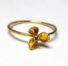 Delicate flower Rings - This beautiful and delicate 18K gold ring inlaid diamond. The Ring is part of My Hidden Seed Collection. The Ring is handmade and one of a kind ring. The size is approximately a diameter of 8mm. The Ring will be packed in a gift box and is ready to give as a gift. Free Shipping Your item will be shipped via registered air mail with tracking number. Please contact me with any questions or requests. Gold Flower-shaped Diamond Ring, Gold Flower Ring With Single Diamond For Wedding, Gold Wedding Flower Ring With Single Diamond, Wedding Yellow Gold Flower Ring With Diamond, 14k Gold Flower Ring With Single Cut Diamonds, Yellow Gold Flower Ring With Single Diamond For Wedding, Flower Shaped Yellow Gold Rings With Single Cut Diamonds, Flower-shaped Yellow Gold Rings With Single Cut Diamonds, Yellow Gold Flower-shaped Rings With Single Cut Diamonds