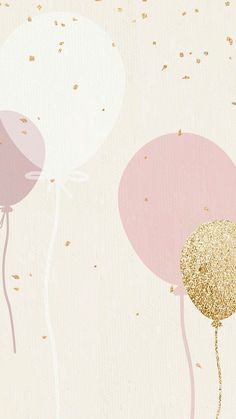 two pink and gold balloons floating in the air with confetti on it's tails