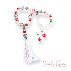 Red and white and green and white striped handblown glass beads are reminiscent of traditional Christmas colors, so I strung them with faceted green and clear glass beads in various sizes and a handmade white fiber tassel. Red And White Christmas, Necklace And Earrings Set, Traditional Christmas, Themed Jewelry, Original Jewelry, Necklace And Earrings, Christmas Colors, Christmas Traditions, White Christmas