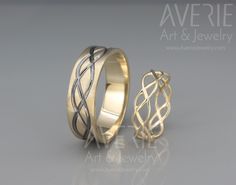 two wedding bands made to look like intertwined rings, one in yellow gold and the other in silver