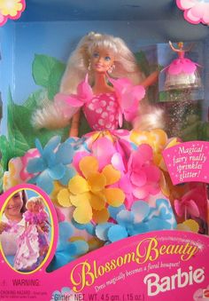 the barbie doll is in its box with flowers on it's head and dress