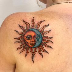 a woman with a sun and moon tattoo on her back