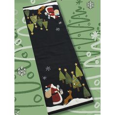 a black towel with santa and reindeers on it