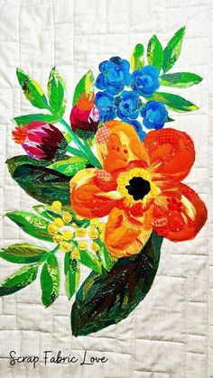 a painting of colorful flowers in a vase on a white quilted piece of cloth