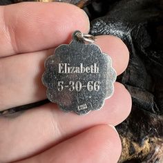 Vintage Charm for a BraceletSmall sterling silver special delivery stork dangle style charm. The reverse has the name Elizabeth and the birth date 5-30-66 on it. I have not polished the charm as you may like the silver patina and I wanted you to be able to decide the finish. Weighs 2.8 gramsDiameter 21.8 mmPlease note that color may vary a small amount because of my lighting. If you have questions please ask and I would be happy to help! -Michelle Collectible Silver Engraved Charms, Silver Engraved Charms For Mother's Day, Engraved Silver Charms For Mother's Day, Mother's Day Engraved Silver Charms, Silver Engraved Charms For Collectors, Vintage Silver Nameplate Jewelry, Vintage Engraved Sterling Silver Charms, Vintage Engraved Pendant Charms, Engraved Pendant Charms For Anniversary