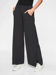 Athleta Gramercy Track Trouser Black (FIRST PICTURE) SIZE 6 #376009 EXCELLENT USED CONDITION $108.00 FIT & SIZING Semi-fitted, Mid rise Wide through the thigh and leg for an easy fit, Sits at the natural waist Inseam: Regular: 30" Petite: 28" Tall: 33" PRODUCT DETAILS FOR: Commuting in, working at the office, and travel  FEEL: Recycled Featherweight Stretch™ fabric feels sleek and light as air   FAVE: Side snaps along the leg to adjust your fit and styling Back zip pockets secure your essentials Work And Travel, Travel Pants, Trouser Pants, Work Pants, Picture Sizes, Cropped Pants, Track Pants, Fabric Care, Black Pants