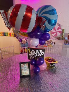 balloons, candy and candies are on the table