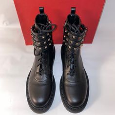 These Boots Are Super Chic. Combat Boots Have Been In Style For Years. These Would Look Great With A Dress, Or Jeans. Can Wear Them In Fall And Winter. The Studs Are Shiny Black And Shine When You Walk. Just A Gorgeous Shoe. Masculine Combat Boot With A Nice Feminine Touch Due To The Studded Buckles! Valentino Leather Mid-Calf Combat Boots Black Rockstud Accents Rubber Trim Round-Toes With Studded Accents Multistrap & Concealed Zip Closure At Sides Includes Box & Replacement Studs Fit: 39 Eu, Us Black Calf Leather Boots With Rivets, Studded Leather Boots With Pointed Toe, Leather Lace-up Boots With Rivets, Studded Leather Ankle Moto Boots, Designer Calf Leather Moto Boots With Round Toe, Studded Leather Ankle Boots, Leather Ankle Moto Boots With Studs, Leather Lace-up Moto Boots With Rivets, Leather Boots With Spikes For Evening