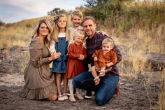 a family poses for a photo in the desert