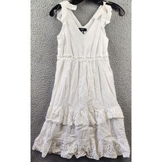 Aqua Eyelet Tie Strap Tiered Midi Dress Girls' M(9/10) White Sleeveless Pullover Aqua Eyelet Tie Strap Tiered Midi Dress Girls' M(9/10) White Sleeveless Pullover Retail $88.00 This Aqua Eyelet Tie Strap Tiered Midi Dress Is Perfect For Any Casual Occasion. The Dress Features A V-Neckline And Pullover Closure, With Eyelet Accents That Add A Touch Of Elegance. The Elasticized Waist With Ruffle Trim And Self-Tie Shoulder Straps Ensure A Comfortable And Stylish Fit. The Dress Is Made Of 100% Co Spring Cotton Sleeveless Dress With Lace Trim, Spring Casual Sleeveless Dress With Lace Trim, Casual Sleeveless Sundress With Lace Trim, Short Sleeve Lace Dress, Aqua Dress, Tie Front Cardigan, Tiered Midi Dress, Sleeveless Pullover, Dress Girls