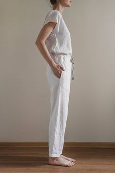 "When ordering you can choose to have the \"PANTS\" or \"TOP\" only or the whole \"PAJAMA SET\" of both items. When buying a set you save 5 euro. Relaxed fit milky white Eva pants with two pockets and fabric strap. Short sleeve AUDREY top with boat neckline. TOP: - length is ± 62 cm (24.4\") (depends on size) - short dolman sleeves - relaxed fit BOTTOM: - outseam is ± 98 cm (38.5\") (depends on size) - inseam is ± 70 cm (27.5\") - elastic waistband with fabric strap - two side pockets DETAILS: - Casual White Jumpsuits And Rompers For Loungewear, Casual Cream Sleepwear For Home, White Jumpsuits And Rompers For Spring Lounging, White Jumpsuit For Spring Lounging, Beige Linen Jumpsuits And Rompers For Loungewear, Casual Cream Jumpsuits And Rompers For Loungewear, White Linen Sleepwear For Loungewear, Casual Spring Sleep Jumpsuits And Rompers, Pajama Set Summer