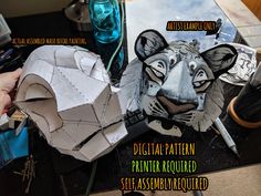 a paper mache of a tiger on a table with other items and tools around it