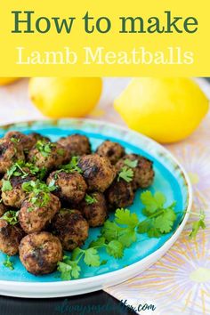 lamb meatballs with lemon and cilantro on a blue plate next to lemons