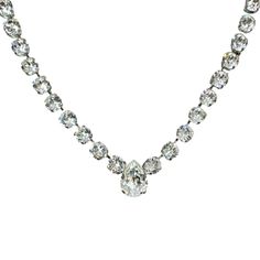 Shine bright like a pear-shaped diamond with our Swarovski Crystal Pear Necklace. The sparkling crystal, set in a rhodium-plated setting, adds a touch of elegance and dazzle to any look. Perfect for special occasions or adding a touch of glam to your everyday style. Elegant Pear-shaped Rhinestone Jewelry, Formal Pear-shaped Crystal Necklaces, Silver Teardrop Crystal Rhinestone Necklace, Silver Teardrop Rhinestone Necklace, Teardrop Crystal Necklaces For Evening, Teardrop Crystal Necklace For Evening, Classic Pear-shaped Crystal Jewelry, Classic Diamond White Rhinestone Necklace For Formal Occasions, Sparkling Pear-shaped Crystal Jewelry