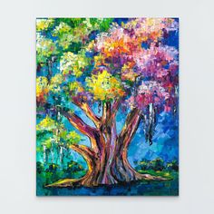 a painting of a colorful tree on a white wall