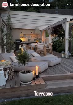 an outdoor living area with patio furniture and candles