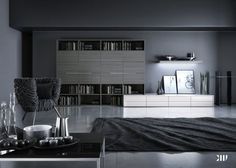 a living room filled with furniture and bookshelves next to a wall mounted bookcase