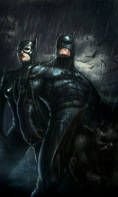 batman and catwoman standing in the rain