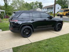 a black jeep parked on the side of a road