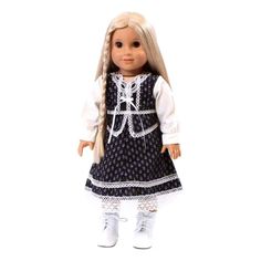 a doll with blonde hair wearing a blue dress and white shoes, standing on a white background