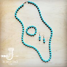 This Turquoise Blue and Wood Bracelet offers a boho western style that is perfect for any fashion-forward individual. With a unique blend of earthy tones and rustic details, this bracelet adds a touch of natural charm to any outfit. Versatile and trendy, it's a must-have accessory for any jewelry collection. Size: Stretches to fit a variety of wrist sizes Wear with the matching necklace and earrings Bead Size: 8-10mm Genuine Howlite stones Handmade in the USA Although your bracelet will resemble Rustic Turquoise Beaded Bracelets With Natural Stones, Turquoise Jewelry With Round Wooden Beads, Adjustable Turquoise Necklace With Wooden Beads, Turquoise Beaded Bracelets With Wooden Beads, Turquoise Wooden Beads Jewelry Gift, Rustic Handmade Turquoise Beaded Bracelets, Rustic Turquoise Bracelet Jewelry, Rustic Turquoise Bracelet, Rustic Turquoise Bracelets For Jewelry Making