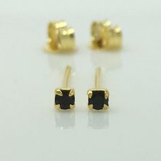 Extra small black diamond cz stones set in sterling silver posts and plated in yellow gold.  Sold as a pair.Metal: Premium 925 sterling silverOuter plating:  24K yellow goldStone: black diamond CZEar post Gauge: 20G, normal piercingDiameter:  2mmEar post: 11mm, 20 gauge normal piercingMeasurements are an approximationOther diamond cz  stud earringshttps://www.etsy.com/shop/360Jewels?ref=hdr_shop_menu§ion_id=7442341Thank you for your interest in our tiny black cz diamond stud earrings. Gold Earrings With Black Diamonds For Gift, Mens Silver Earrings, Fake Plugs Earrings, Mens Diamond Earrings, Stud Earrings Black, Fake Gauge Earrings, Earrings Cartilage, Black Diamond Studs, Black Diamond Earrings