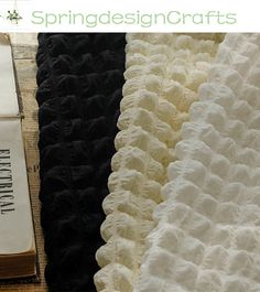 two pieces of black and white fabric next to each other with the words springdesigncrafts on it