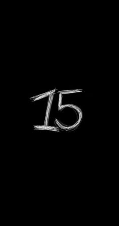 the number fifteen is written in chalk on a black background